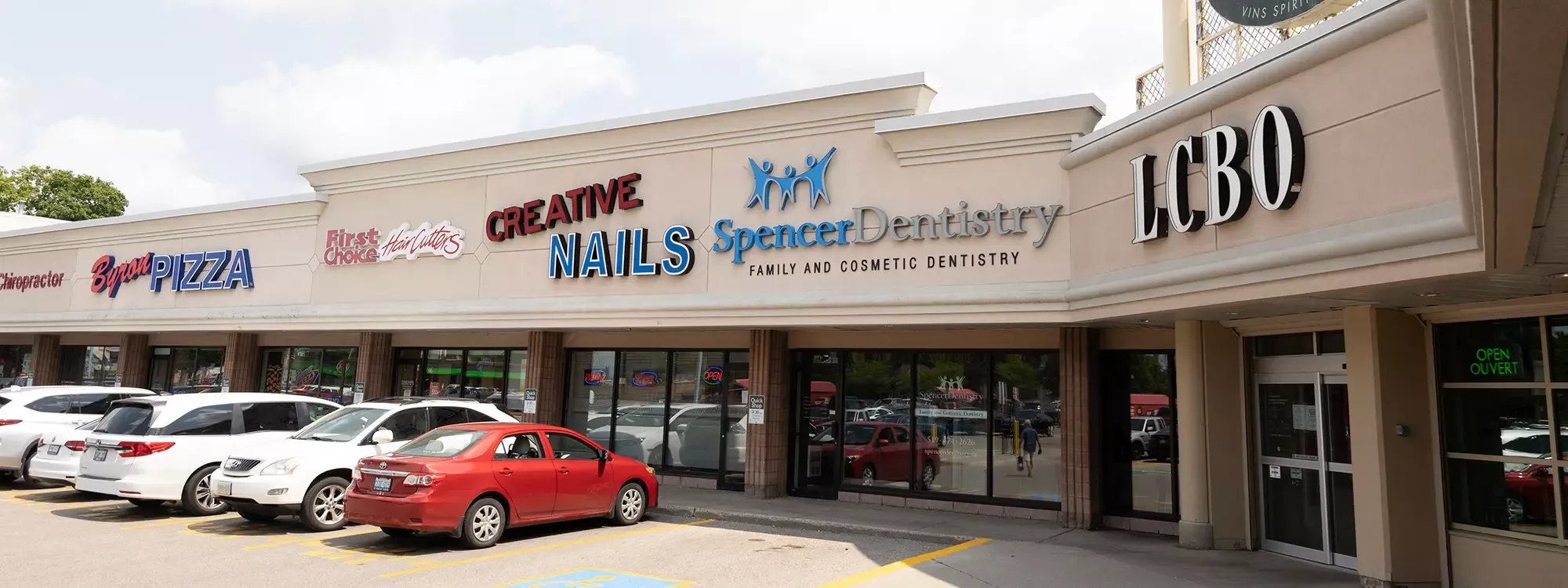 Spencer Dentistry logo mounted on wall